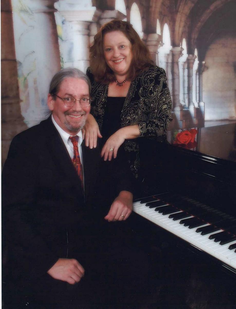 Hiding behind my husband and a piano! Christmas 2007