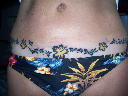 Tattoo over tummy tuck scar/ 30 lbs. lighter